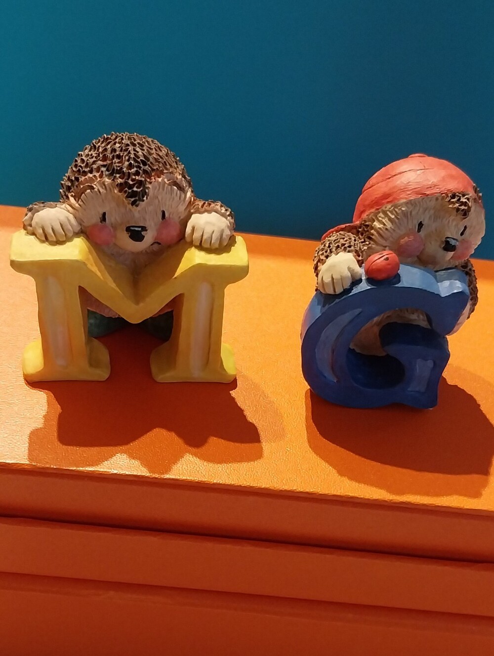 Decorative Hedgehog Figurines with Yellow M and Blue G - Small Pets Category